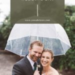 Bride and groom under a rain umbrella