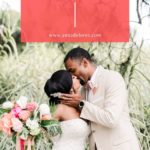 Bride and groom kissing with wedding bouquet