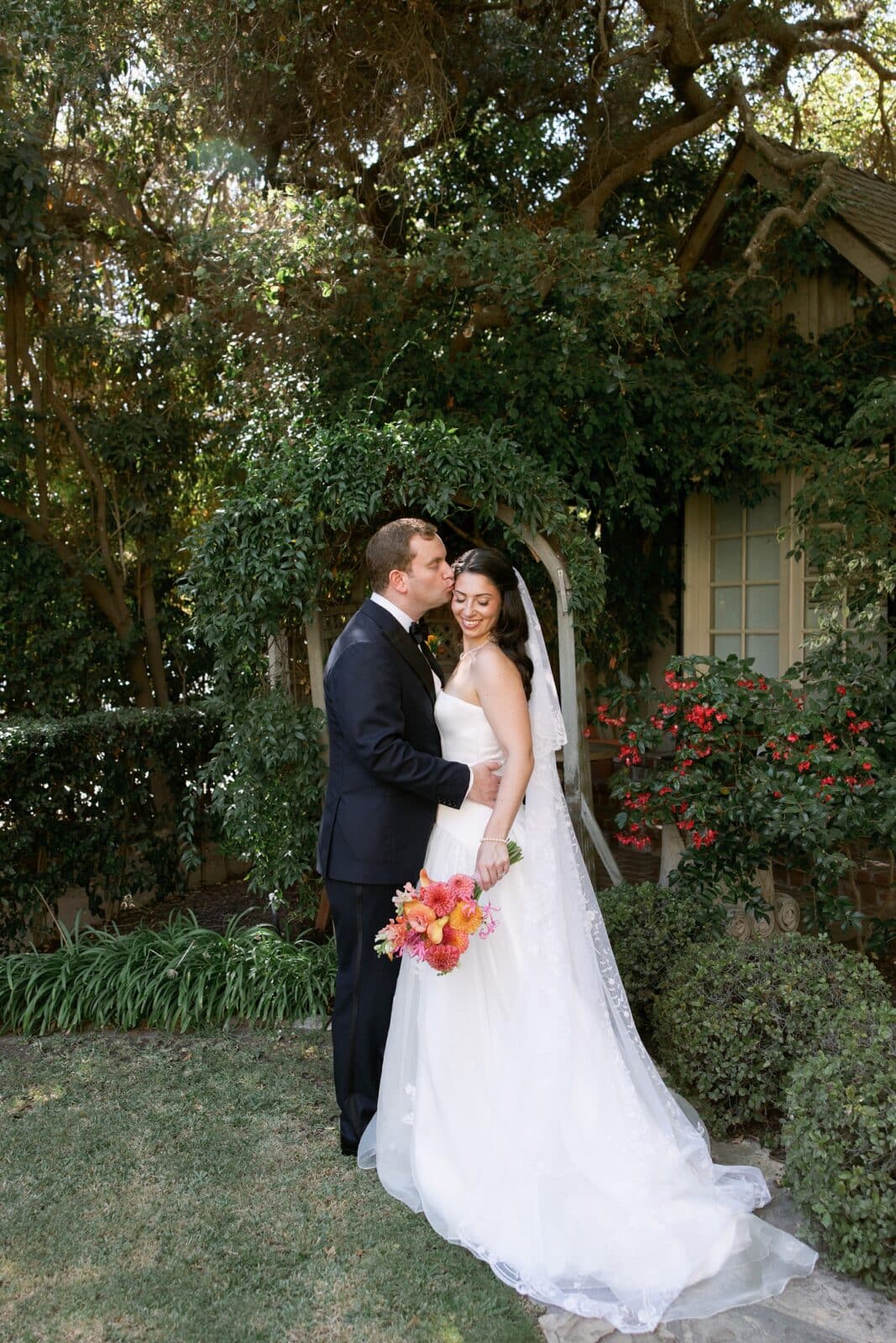 Bride and groom kiss at their Simpson House Inn wedding